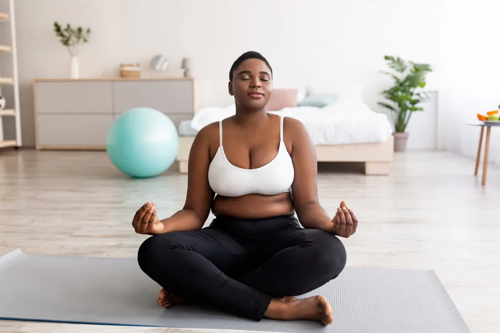 Plus,Size,Black,Woman,Sitting,In,Lotus,Pose,,Meditating,With